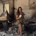 British mother breaks down in tears as she surveys the smouldering remains of her Cyprus villa after family was forced to flee deadly wildfires with seconds to spare