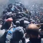 Videos 'show hundreds of frantic Gazans swarming aid trucks' as Israel pauses fighting amid war of words over 'starvation' and who is to blame 