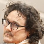 TV star charged with multiple rapes sports ghastly prison appearance during accuser's terrifying testimony