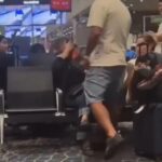Brawl explode o aeroporto depois que um homem coloca um sussurro para acordar no assento ao lado de sua esposa